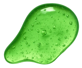 A glossy, translucent green gel or slime-like smear with visible water droplets, isolated on a plain white background.