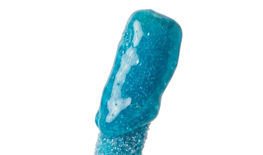 A close-up of a blue, glittery, and glossy candy stick on a plain white background.